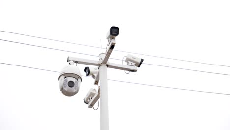 view of outdoor cctv surveillance cameras mounted on a pole, observing the surroundings in china. showcasing modern security technology and monitoring infrastructure.