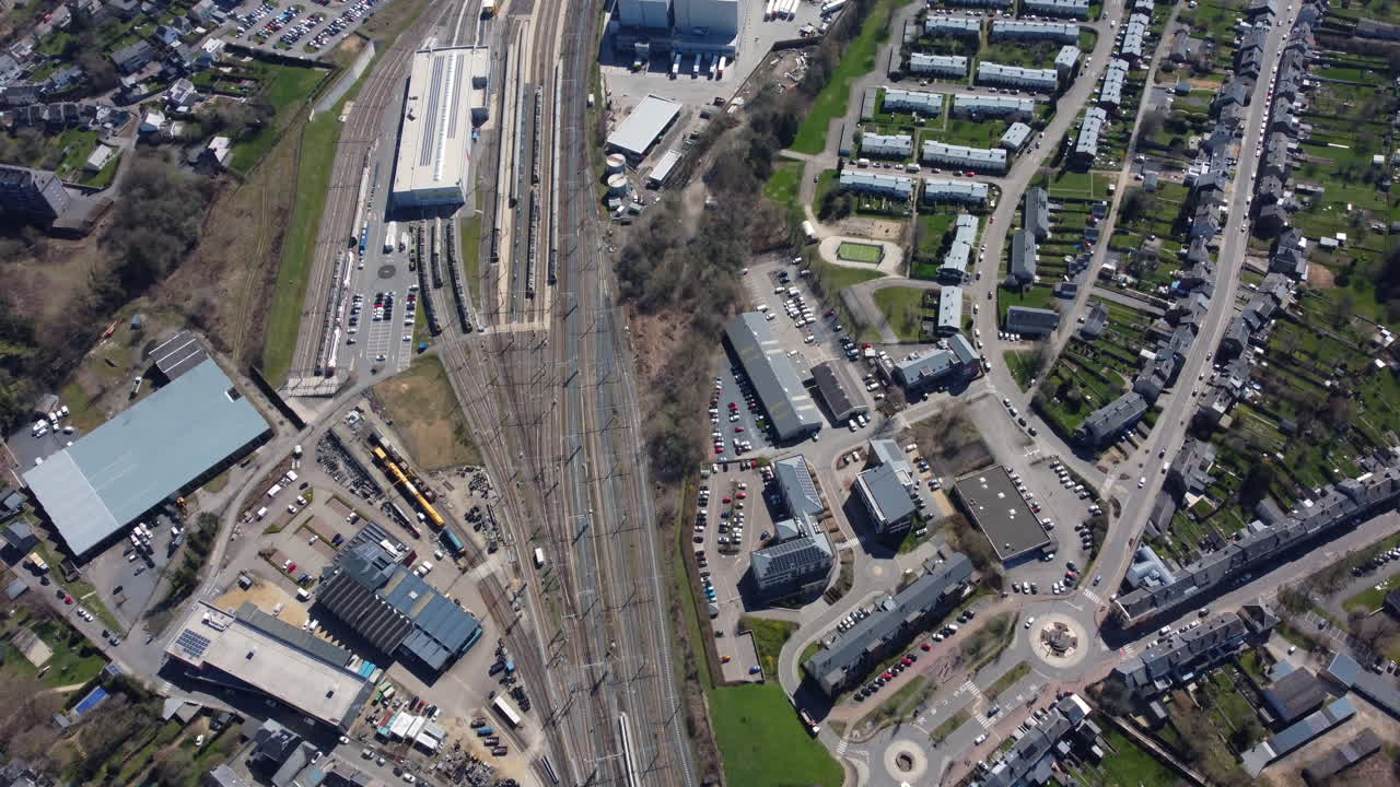 Aerial View of a Town with Train Tracks and Residential Area