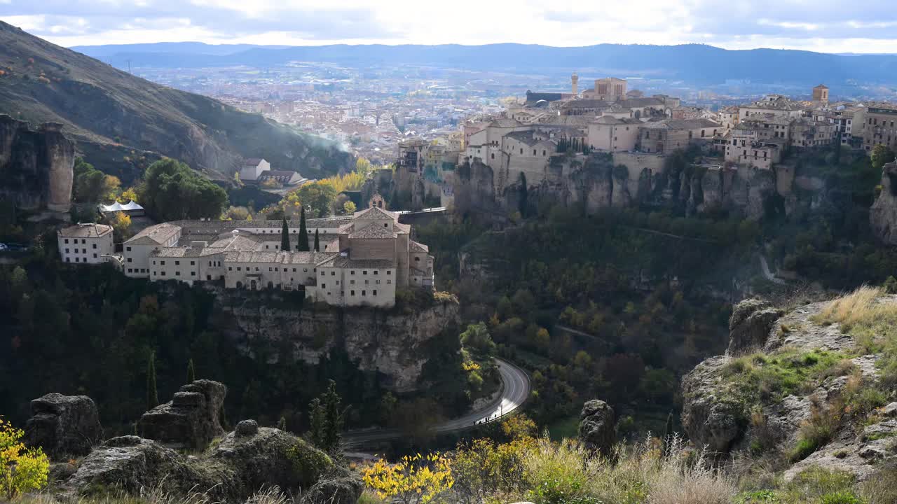 The panoramic view and dramatic beauty of Cuenca, Spain, is captured in this view of the Parador hotel and Hanging Houses, a must-see destination for travelers and photographers.
