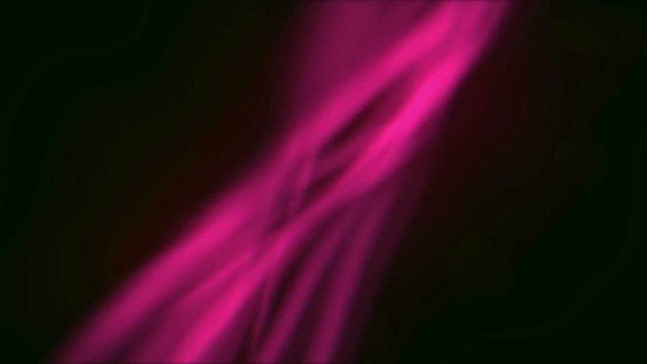 Abstract magenta flowing design against a dark background.
