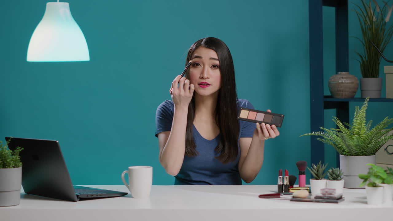 POV of influencer filming makeup tutorial with eyeshadow palette