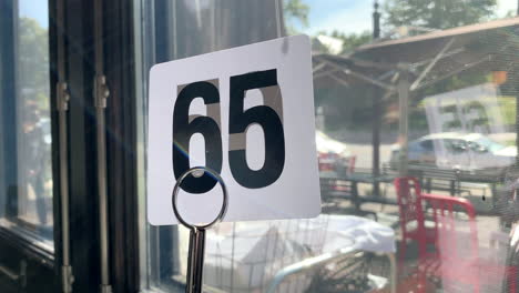 number 65 at a table at a restaurant near a window on a sunny fall day