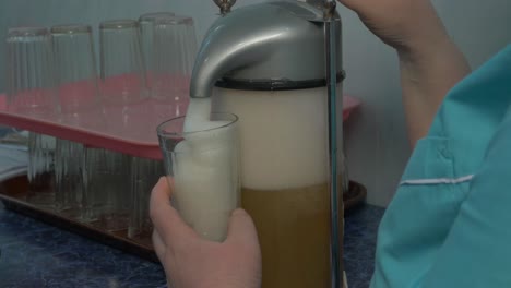 pouring soda from a vintage dispenser