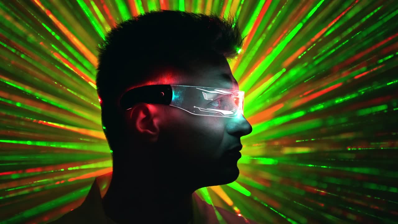 The man in interactive glasses on a colorful rays background