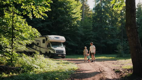 family camping trip in the forest with rv
