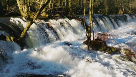 river falls gushing in mountain park of fervenza as feiticeiras, a coruna spain
