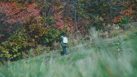 Young-Girl-With-Backpack-Sightseeing-Colorful-Nature-Landscape-During-Autumn-On-Zao-Countryside-In-Japan