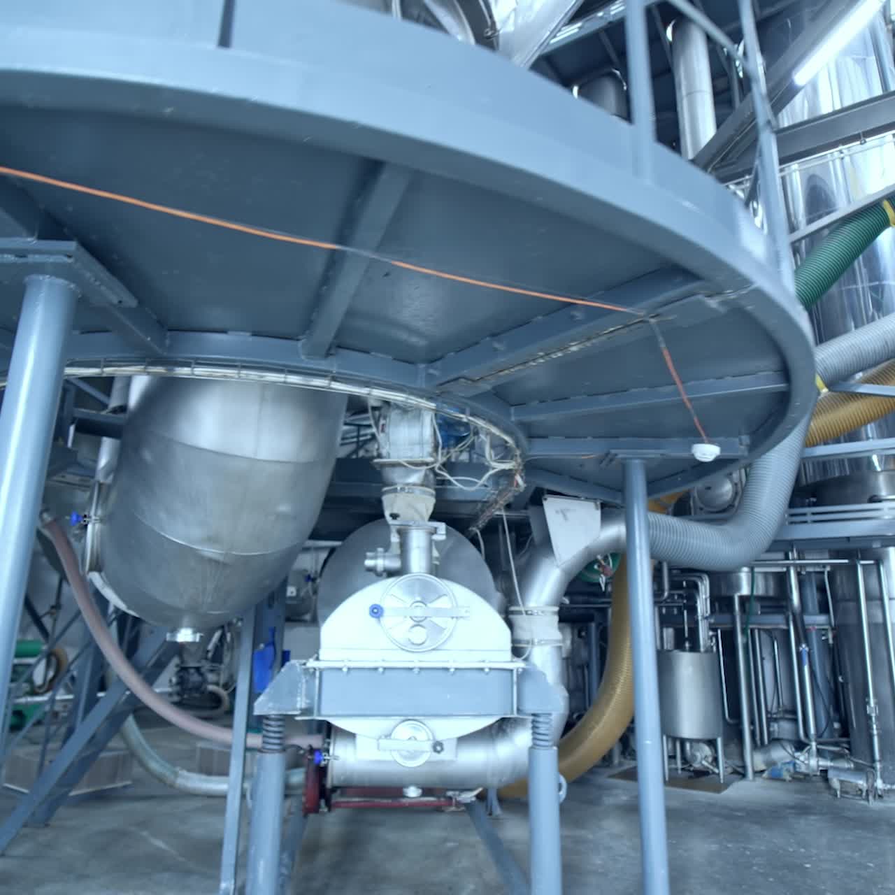 Modern technology of milk producing factory. Stainless diary industrial equipment