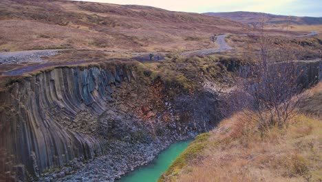 studlagil canyon in iceland with spectacular basalt rock columns