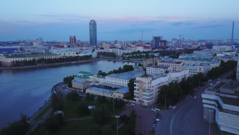 cityscape at dusk with river and park