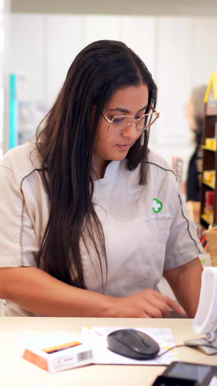 Pharmacy clerk working at the counter