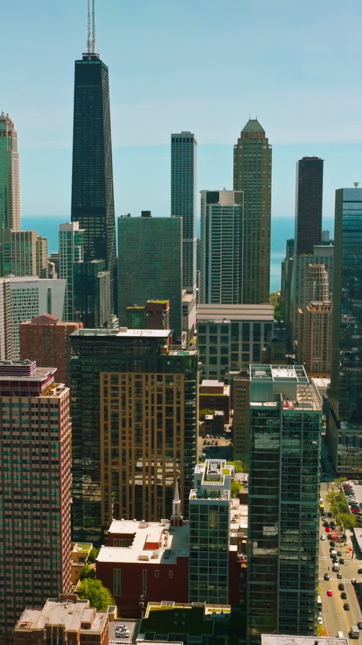Wonderful and diverse buildings of Chicago, Illinois. Drone footage flying over the city at the backdrop of skyscrapers. Vertical video