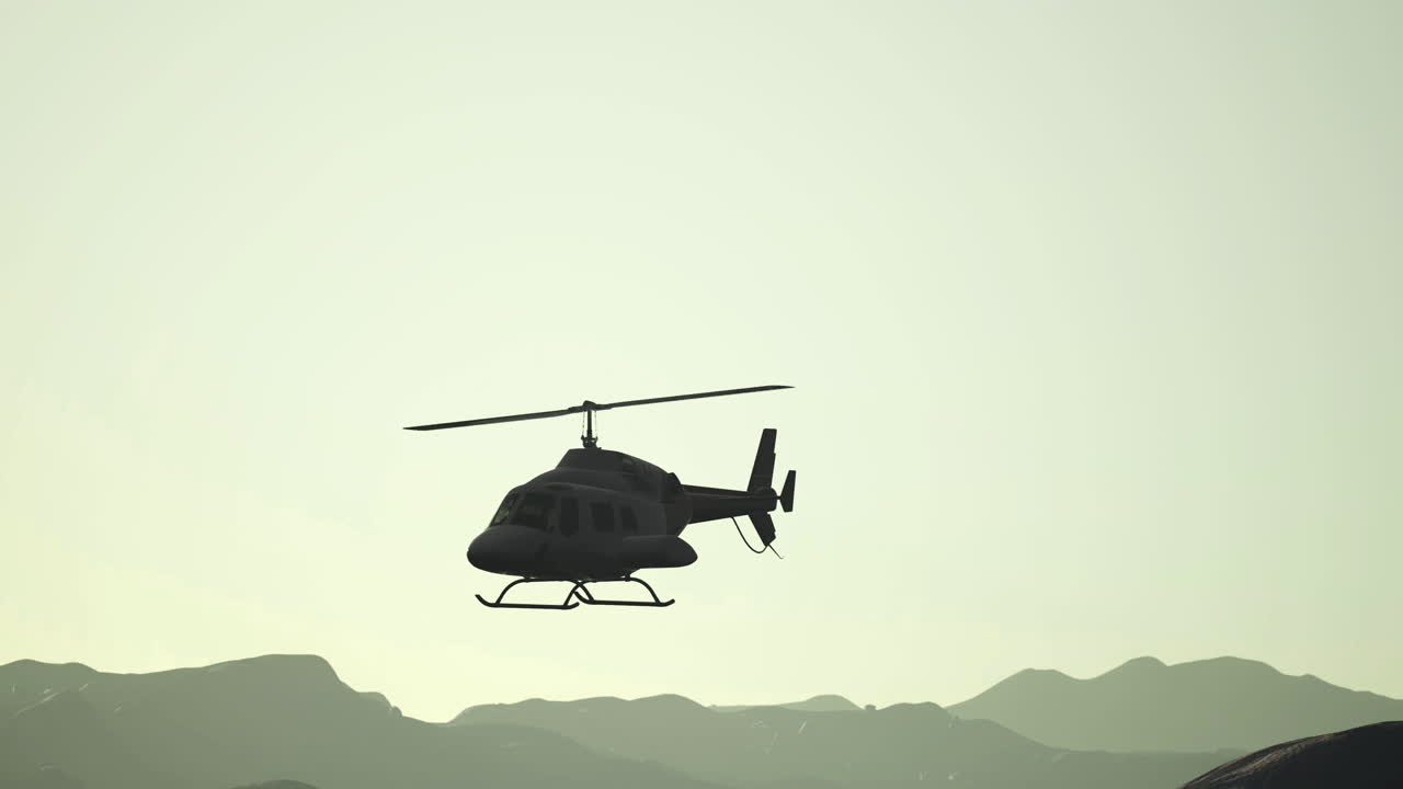 Helicopter flying over mountains during golden hour twilight