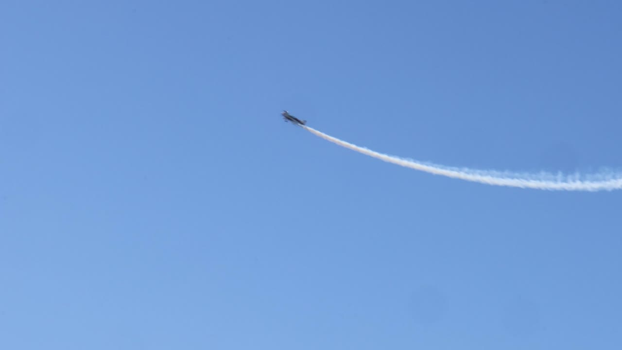 Planes executing precise aerial maneuvers in sequence