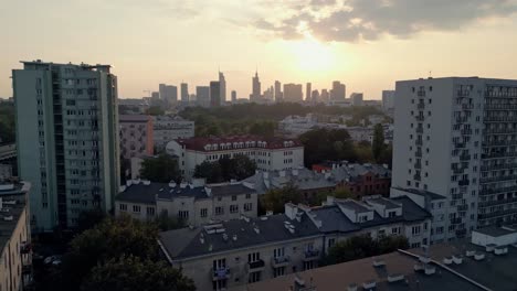 residential buildings at warsaw suburbs, poland with scenic city center skyline, aerial