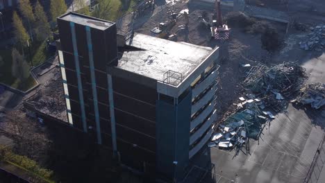 demolished multi storey car park concrete construction debris in town regeneration aerial rear view over demolition site