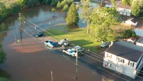 aerial orbit of neighborhood community homes under water