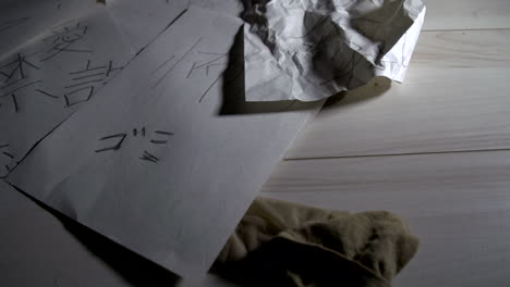 wrinkled papers written lying on the floor