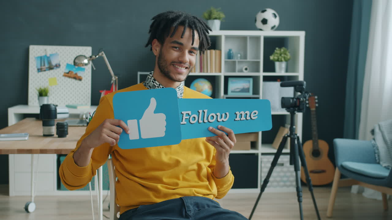 Man Promoting His Social Media Channels in a Home Studio