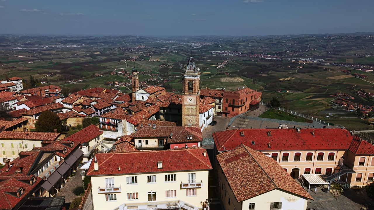 Beautiful aerial view of La Morra old town with Piazza Castello and bell tower, Piedmont, drone flight