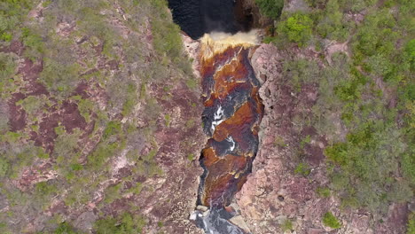 Aerial-view-of-a-waterfall-and-a-river-in-the-middle-of-a-big-vegetation,-Chapada-Diamantina,-Bahia,-Brazil