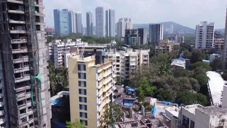 drone footage of india mumbai goregaon bird's eye view of green city and under construction building's