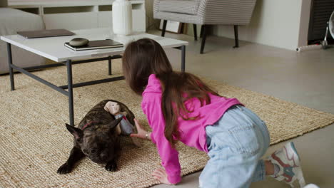 girl taking pictures of dog