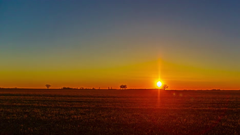 vibrant sunset over farmland landscape, time lapse view