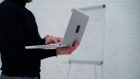 young professional businessman. close up of male hands typing on notebook