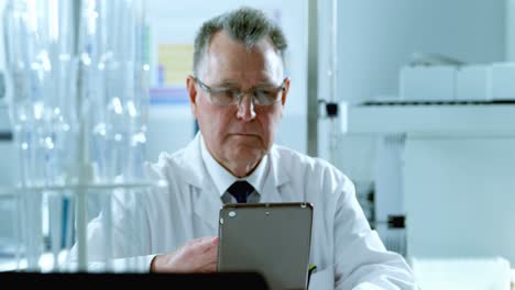 male scientist using digital tablet 4k