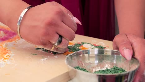 artistic hands crafting traditional rangoli design