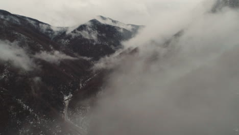 sharp peaks with clouds around them