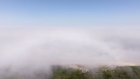 aerial view of fog over coastal landscape