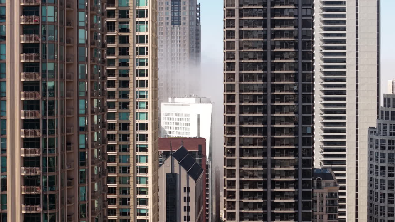 Downtown Chicago USA, Drone Shot of Fog From Michigan Lake Between Towers and Skyscrapers