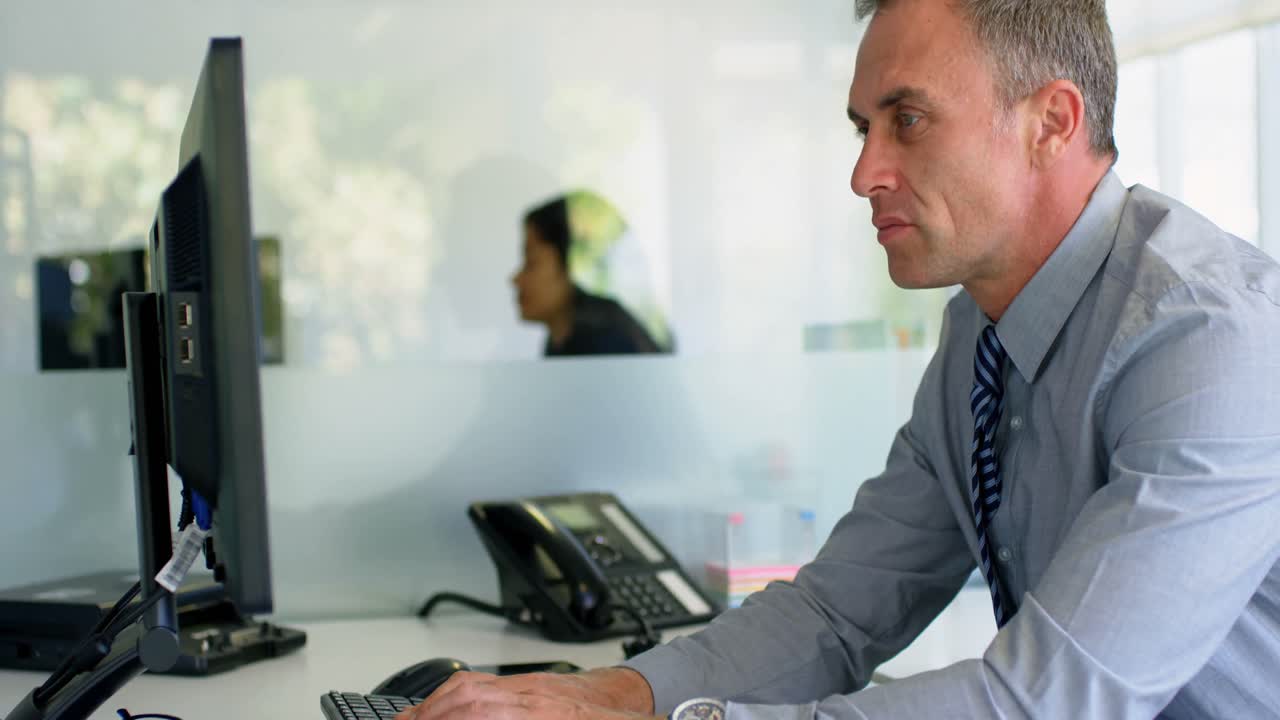 Businessman working on computer art desk 4k