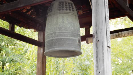 slide shot of an old ancient bell in a temple in kyoto, japan 4k slow motion