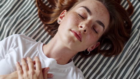 young woman resting peacefully with closed eyes