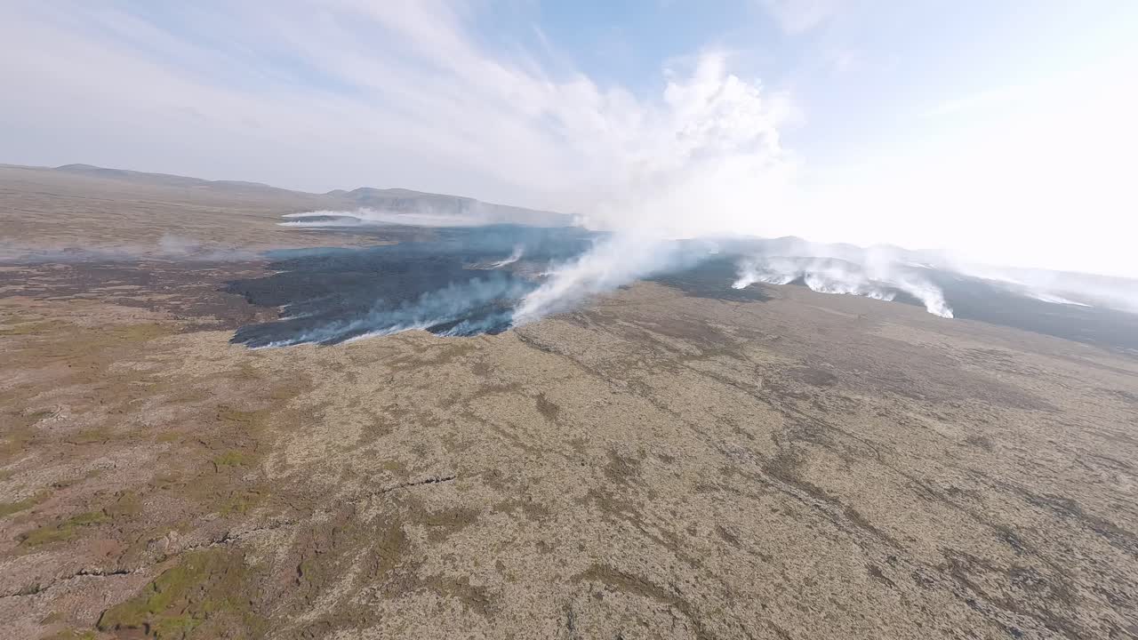 A stunning FPV drone flight over an active Icelandic volcano, capturing molten lava and rugged, volcanic terrain