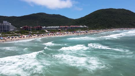 aerial drone hight scene beach florianópolis seen from the top seaside town near the sea horizon buildings urban on the coast ingles beach buildings facing the sea ingleses beach