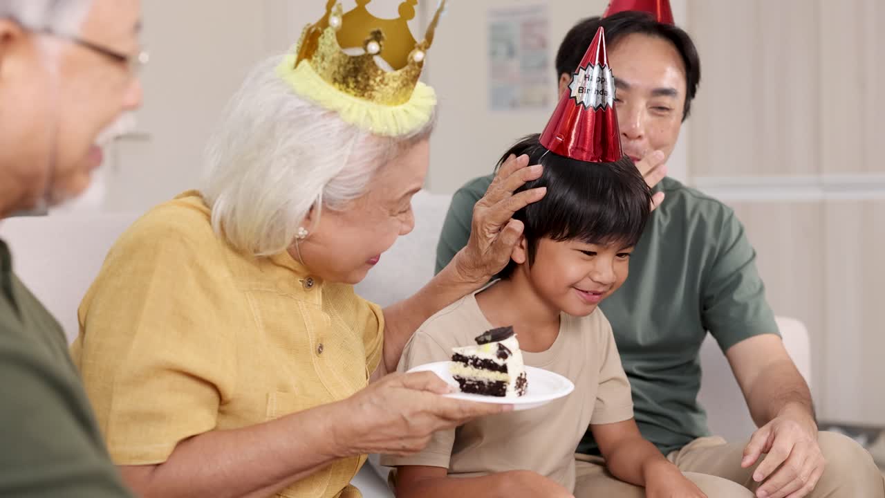 A joyful family birthday gathering with cake, party hats, and shared laughter in a warmly lit living room