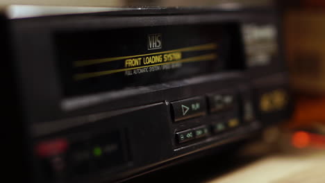 Starting-Playback-of-VHS-Video-Cassette-Tape,-Inserting-and-Pressing-Play-Button-on-VCR,-Close-Up