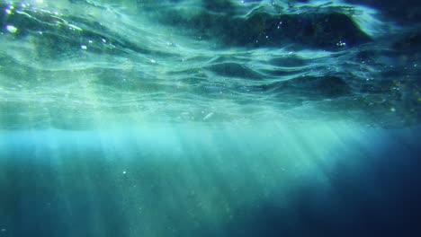 underwater view of ocean's turquoise surface