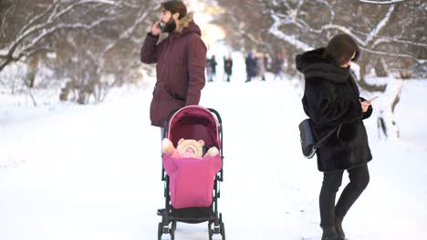 family winter walk in the snow