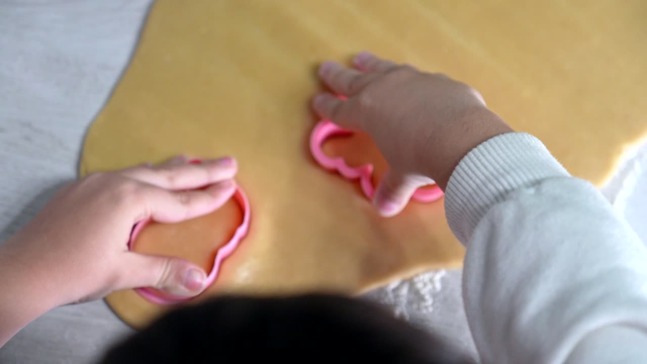 Making cookies with cookie cutters