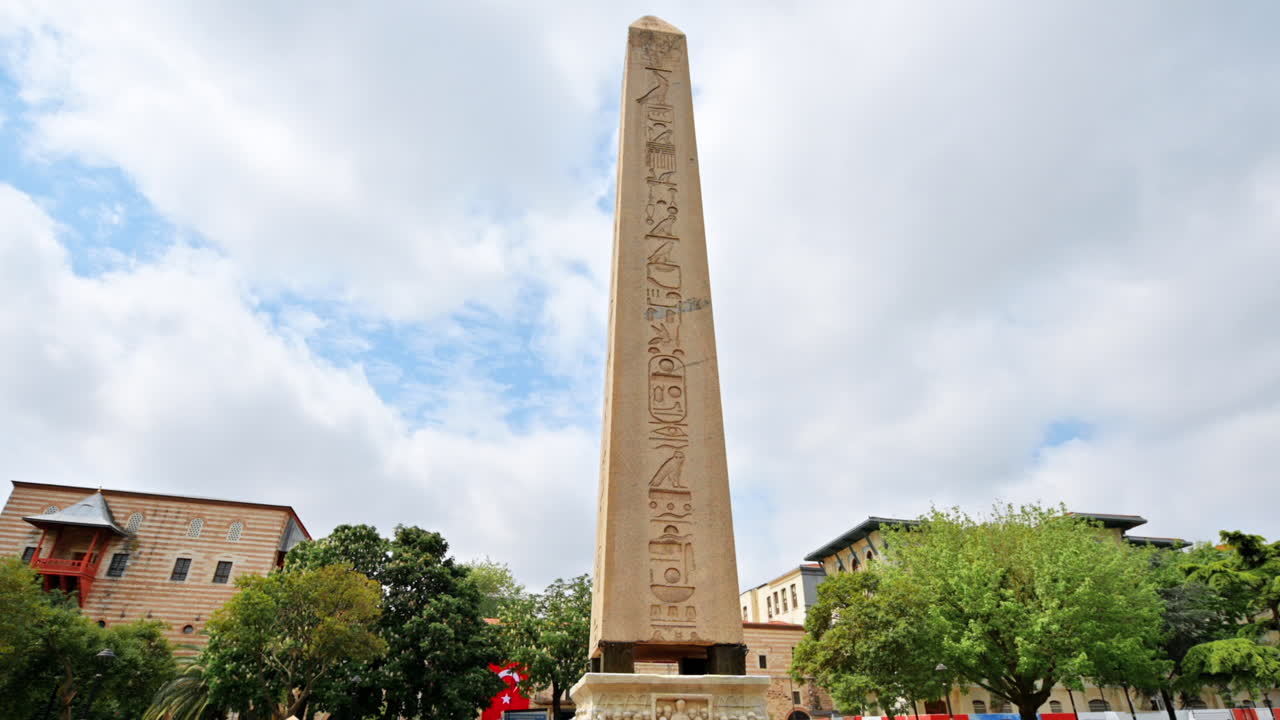 View of the Obelisk of Theodosius with hieroglyphics in Istanbul, Turkey. Greenery around