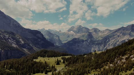 flying towards high mountains in switzerland