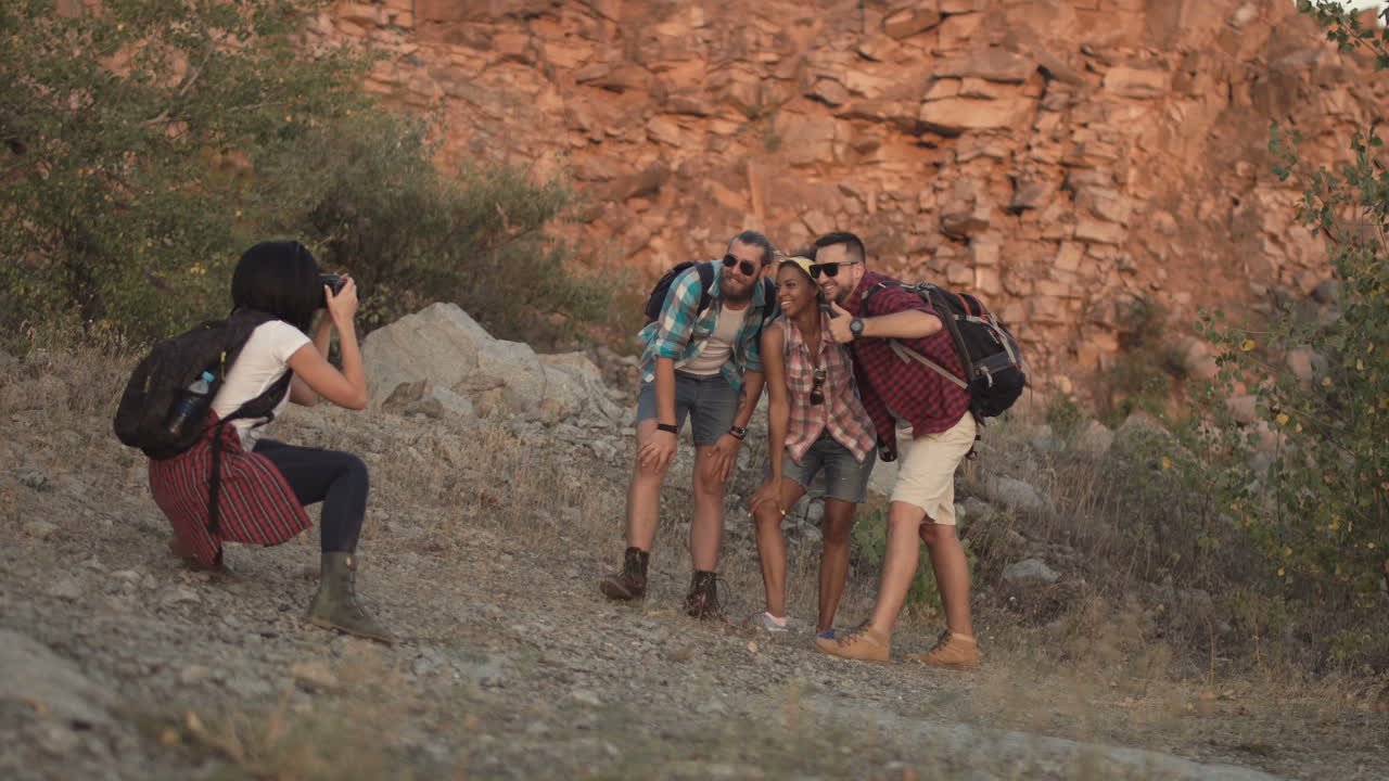 Group of friends taking pictures in a quarry