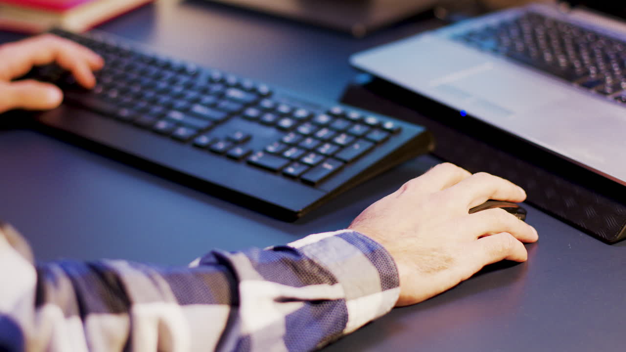 Close up of hands using computer