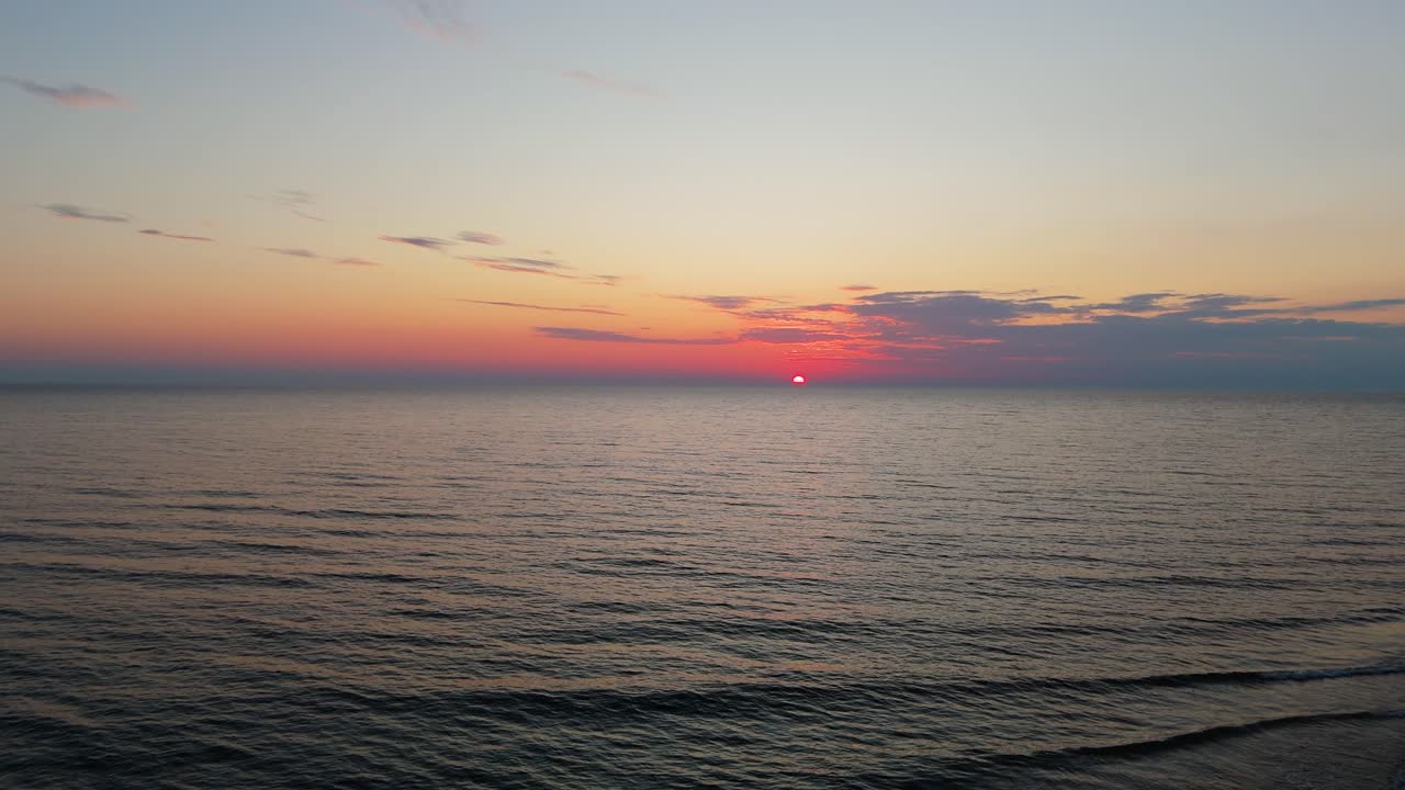 Drone Sunset View Over Uzava River Estuary Beach on the Baltic Sea Coast in Latvia Scenic Aerial Landscape Featuring Golden Light, Waves, Sand Dunes and Peaceful Coastal Atmosphere