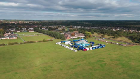 circus fantasia is neatly located on the field outside of breckland. the shot is done on a cloudy autumn day, while sunrays are touching some parts of the field